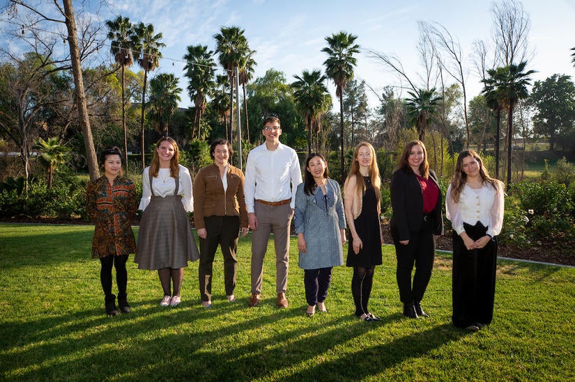 The competitors  during the Grad Slam competition on Thursday, March 3, 2022, at the Alumni and Visitor Center at UC Riverside.  From L to R: Caroline Hung, Paige Goodwin, Claire Whitaker, Nick Robertson, Magnolia Yang Sao Yia, Shanna Dobson, April Gould, and Chelsea Price.  (UCR/Stan Lim)